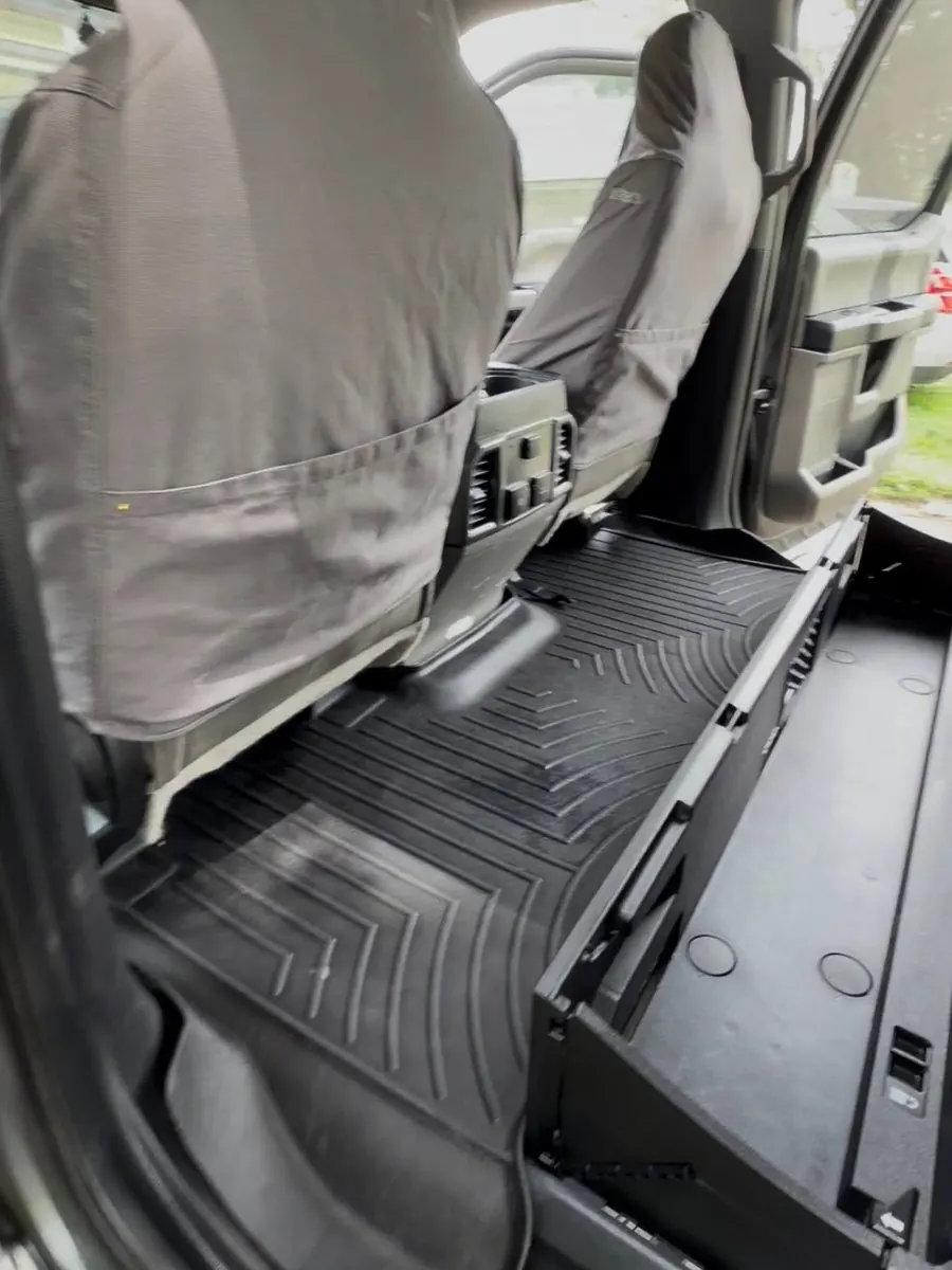 The same pickup back-seat floor liner clean after an interior detail
