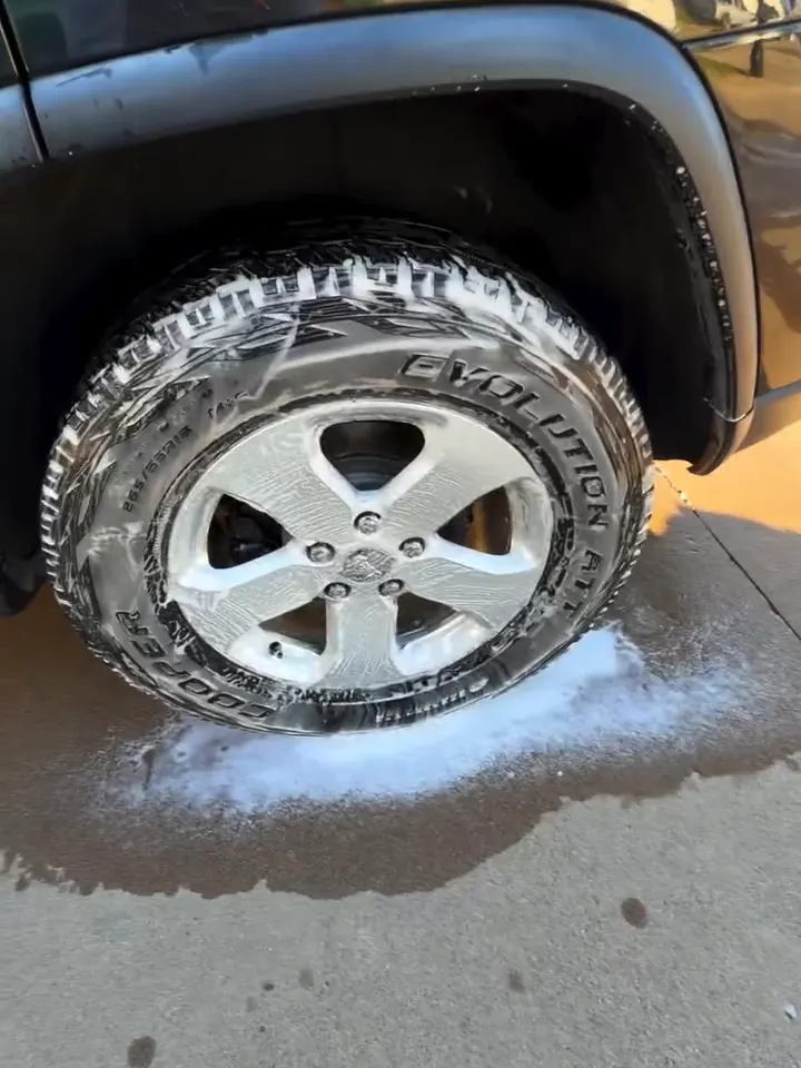 Foamed wheel and tire during a mobile wheel and tire wash